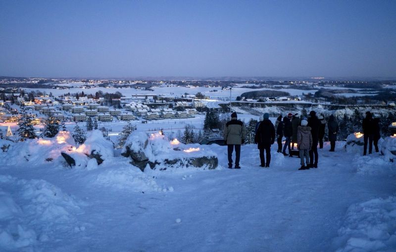 Gjerdrum:People light candles near the landslide area in the village of Ask in Gjerdrum, Norway, Sunday Jan. 3, 2021. Rescue teams searching for survivors found no signs of life Saturday amid the ruined buildings and debris.AP/PTI Photo